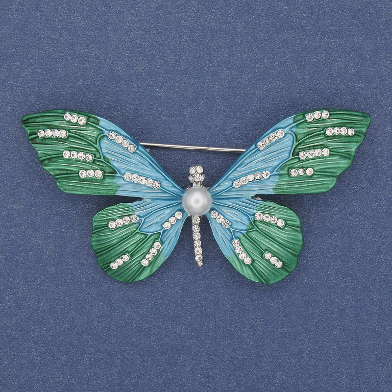 Broche Mariposa con strass blancos, esmalte y metal plateado 60 × 35 mm+