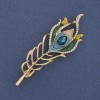 Broche pluma con esmalte y strass en metal dorado 72×24 mm +