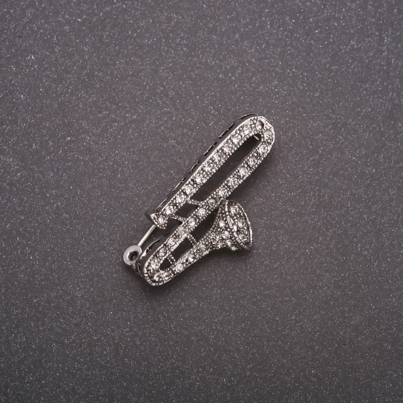Broche «Flauta con strass» de metal gris 38x19 mm
