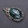 Broche con strass gris y cabochón esmeralda de 64×38 mm, metal gris