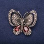 Broche Mariposa con piedras marrones, 50x44 mm, metal amarillo