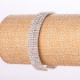 Pulsera de strass de cinco hileras con cierre de metal blanco y cristales blancos