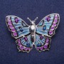 Broche Mariposa con esmalte en metal plateado 43×60 mm