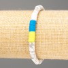 Pulsera «Ucrania» de howlita natural con cuentas cilíndricas de 10×6 mm ± y arcilla polimérica, longitud 18 cm (elástico)
